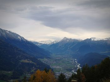 Scenic view of snowcapped mountains against sky