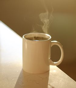 Close-up of coffee cup on table