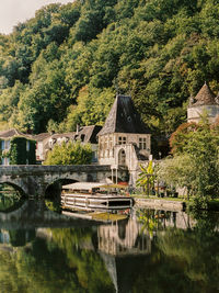 Reflection of an old town in a small river shot on film