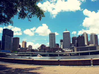 Cityscape against cloudy sky