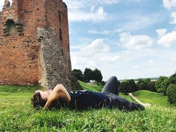 Man lying down on field