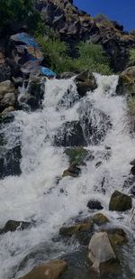 Water flowing through rocks in sea