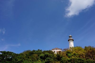 Low angle view of lighthouse against blue sky
