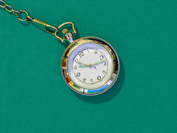 High angle view of clock on table