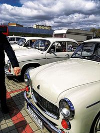 Man driving car against sky