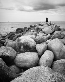 Scenic view of sea against cloudy sky