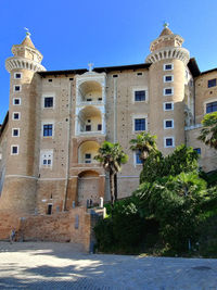 View of historic building against clear blue sky