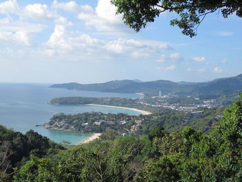 High angle view of townscape by sea against sky