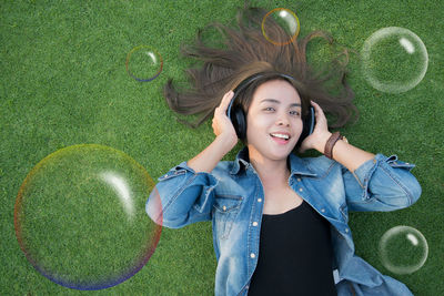 Portrait of a smiling woman lying down