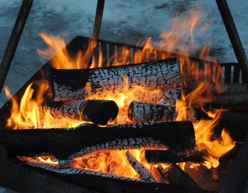 Close-up of firewood burning in fire pit