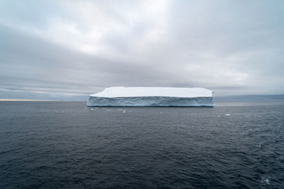 Scenic view of sea against sky during winter