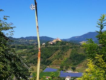 Scenic view of mountains against clear blue sky