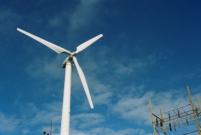 Low angle view of windmill against sky