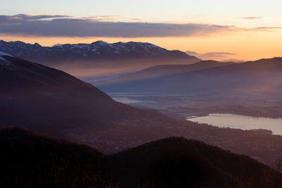 Scenic view of silhouette mountains against sky during sunset