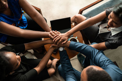 High angle view of people hands