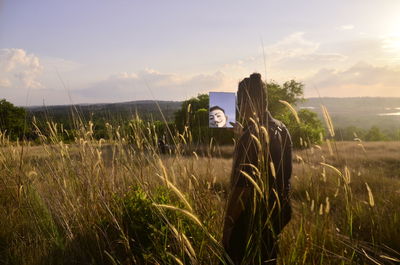 Scenic view of field against sky during sunset