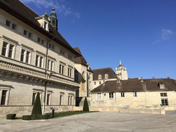 Low angle view of building against blue sky