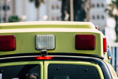 Close-up of vintage car on street