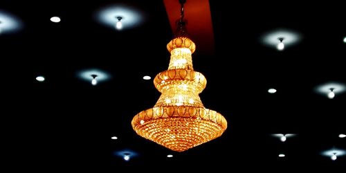 Low angle view of illuminated pendant lights