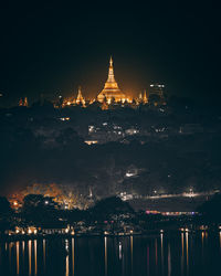 Illuminated buildings in city at night