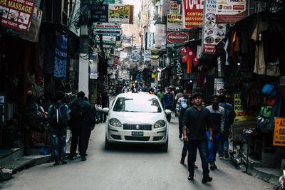 People walking on street in city