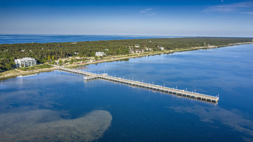 High angle view of swimming pool by sea against sky