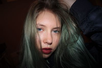 Close-up of woman tousled hair in darkroom