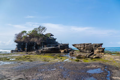 Scenic view of cliff against sky