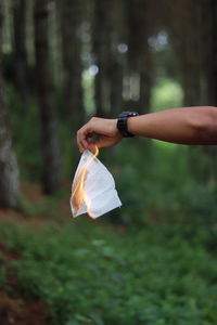 Midsection of woman holding umbrella