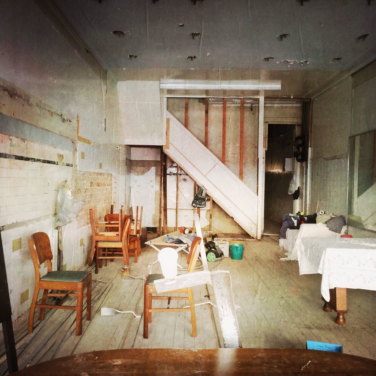 indoors, chair, absence, messy, table, abandoned, empty, house, home interior, architecture, interior, built structure, wood - material, old, furniture, damaged, obsolete, domestic room, window, room