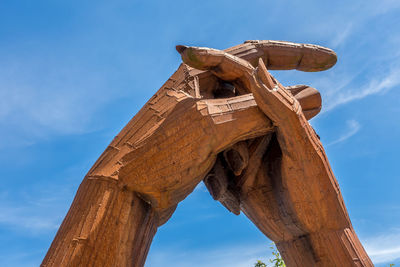 Low angle view of old ruins against blue sky