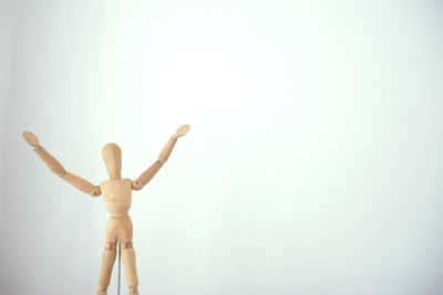 Rear view of person standing against wall