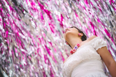 Low angle view of woman looking up