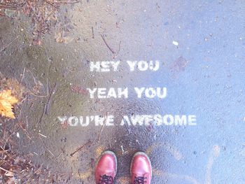 Low section of woman standing on tiled floor