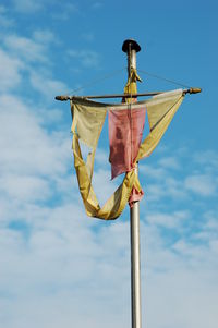 Low angle view of flag against sky