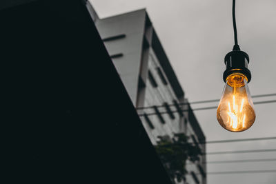 Low angle view of illuminated light bulb