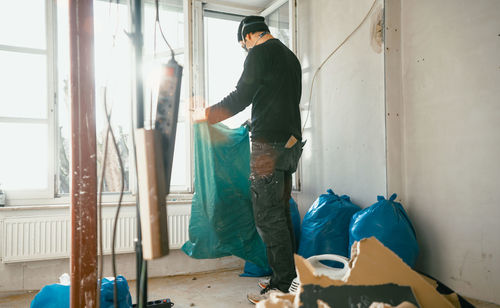 Man working on wall