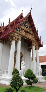 Statue of temple against building