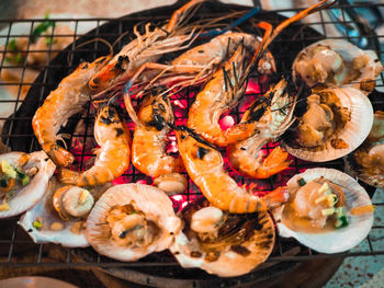 High angle view of food on barbecue grill