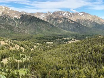 Scenic view of landscape and mountains against sky