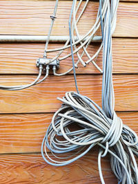 High angle view of cables on wooden table