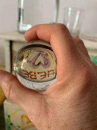 Close-up of hand holding ice cream