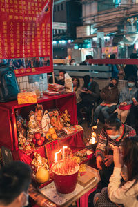 People at market stall