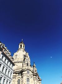 Low angle view of building against blue sky