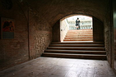 Man walking in tunnel