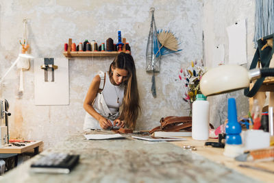 Fashion designer working at workshop