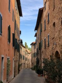 Narrow alley amidst buildings in town