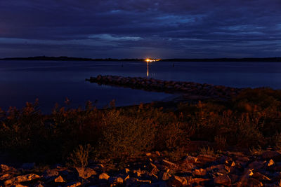 Scenic view of sea against sky at sunset