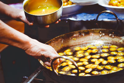 Close-up of person preparing food