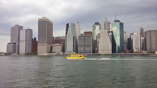 View of modern buildings in city against sky